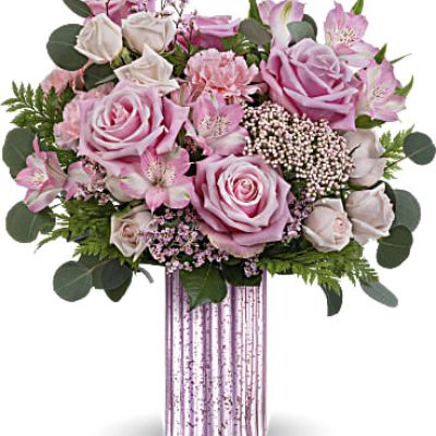 Sparkle with elegance and grace with Teleflora's Amazing Pinks bouquet, nestled in the stunning lavender mercury-inspired finish vase, a timeless adornment perfect for Mother's Day and all year round..