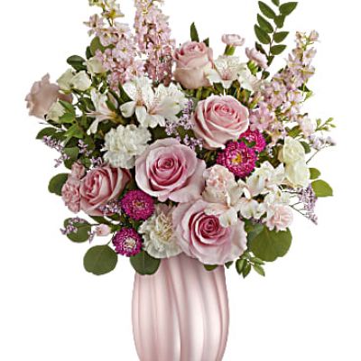 Elevate Mom's day with Teleflora's Rosy Swirls vase, a chic accent to a bouquet of delicate blooms that shimmer with beauty and love.