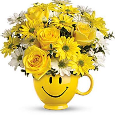 When you're looking to make someone smile, this happy face mug of roses and daisies is tops. Sure to cheer up everyone from a beloved wife to a busy boss, these are also great flowers for kids.
Yellow roses and daisy spray chrysanthemums along with white daisy spray chrysanthemums and oregonia are delivered in a happy yellow happy face mug.