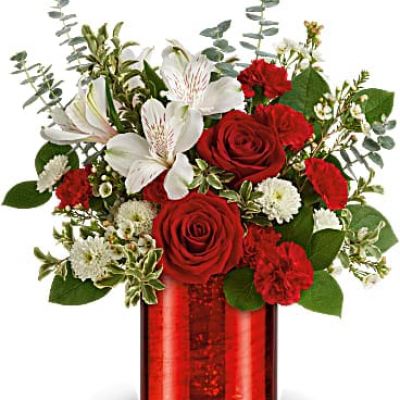 Everyone's crushing on this stunning Valentine's Day gift! Bursting with classic red roses and snow white blooms, this shimmering glass vase with crimson metallic finish is sure to make her heart flutter.