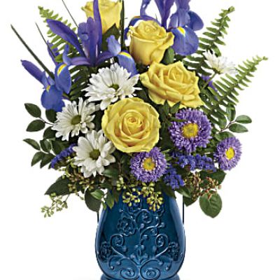 Filled with this charming bouquet of yellow roses and blue iris, or glowing with a votive candle, this stunning sapphire lantern in pressed glass is a gorgeous keepsake gift!