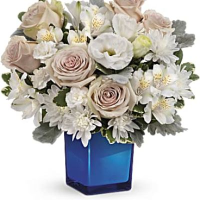 <div id="mark-3" class="m-pdp-tabs-marketing-description">Bursting with gorgeous roses and blooms, this cobalt glass cube vase is a gorgeous gift that can also serve as a beautiful candleholder!</div>
 
<div id="desc-3">This splendid bouquet features crème roses, white cushion spray chrysanthemums, white lisianthus, white alstroemeria, miniature white carnations, dusty miller and variegated pittosporum.</div>