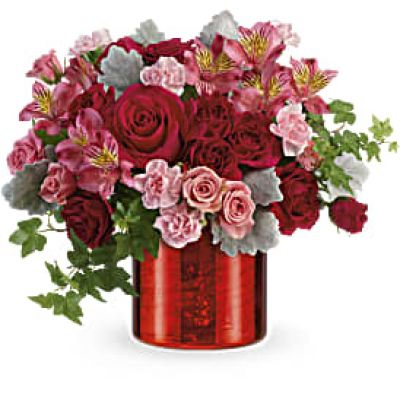 Let your love shine with this gleaming Valentine's Day surprise of romantic red roses in a shimmering keepsake vase with metallic swirl finish.