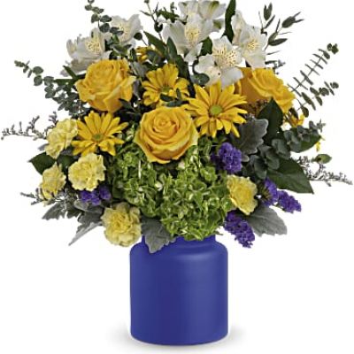 Capture the magic of a sunrise at sea with this radiant white and yellow bouquet, arranged in a frosted glass vase the color of the deep ocean.