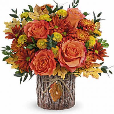 These fabulous blooms are certain to captivate everyone, presented in a magnificent vase inspired by tree bark and adorned with a ceramic autumn leaf charm.