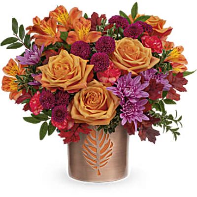 Autumn comes to life in Teleflora's Autumn Abloom Bouquet that is artfully arranged in a fall-fabulous keepsake vase of copper-finished metal with delicate leaf cutout.