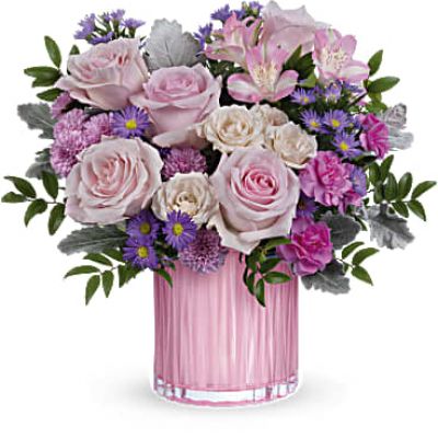 Rosy, radiant and perfectly posh! Teleflora's Rosy Pink Bouquet with a fabulously feminine arrangement in a pearlescent pink glass vase with sculpted details is the perfect Mother's Day surprise.